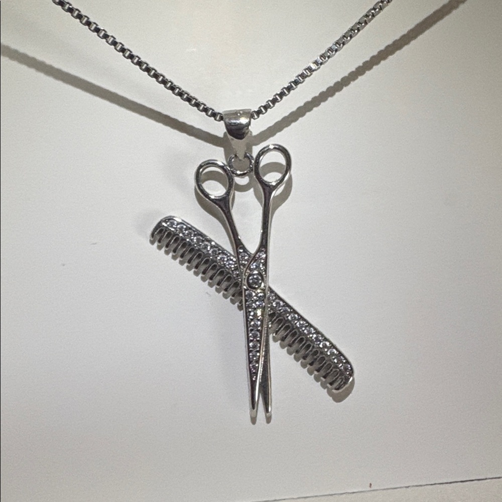 Silver necklace with shear/comb pendant